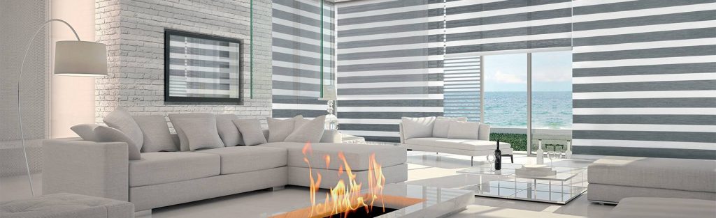 A modern livingroom with custom cut Hunter Douglas blinds.